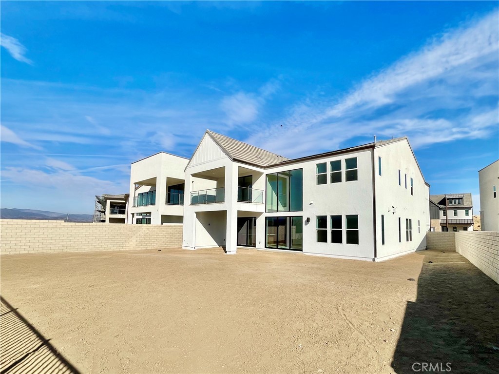 27557 Elderberry Drive Valencia, CA 91381 - Photo 34 of 39 a big house with large windows