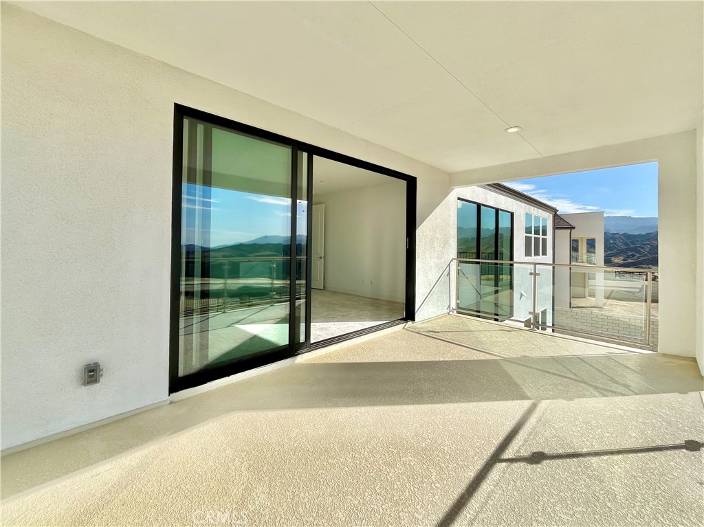 27557 Elderberry Drive Valencia, CA 91381 - Photo 36 of 39 a bedroom with a bed and large windows