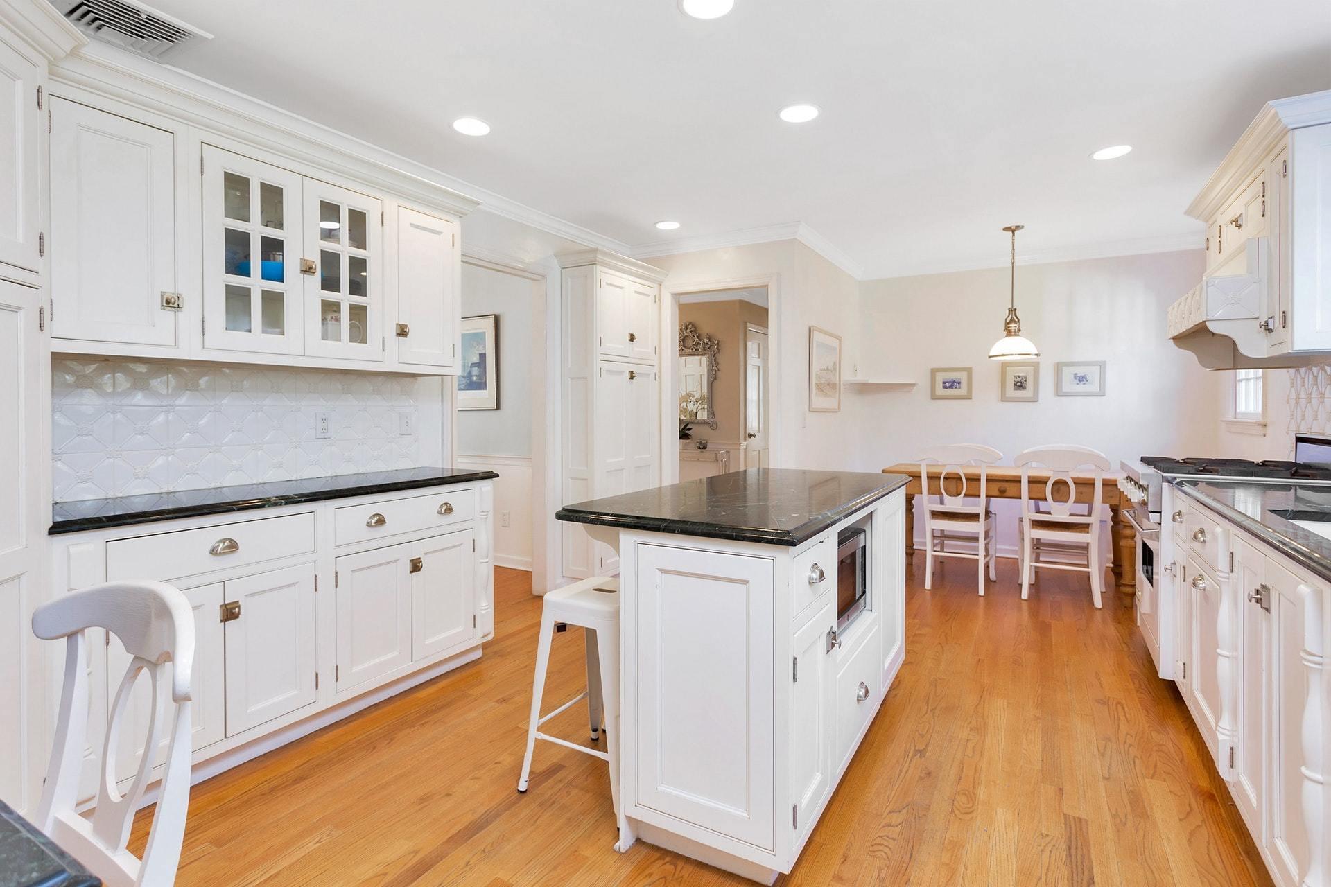 451 Middlesex Road Darien, CT 06820 - Photo 12 of 40 a kitchen with granite countertop a sink a counter top space stainless steel appliances and cabinets