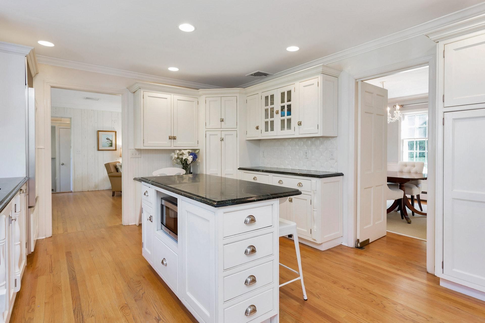 451 Middlesex Road Darien, CT 06820 - Photo 13 of 40 a kitchen with stainless steel appliances granite countertop a stove a sink and a refrigerator