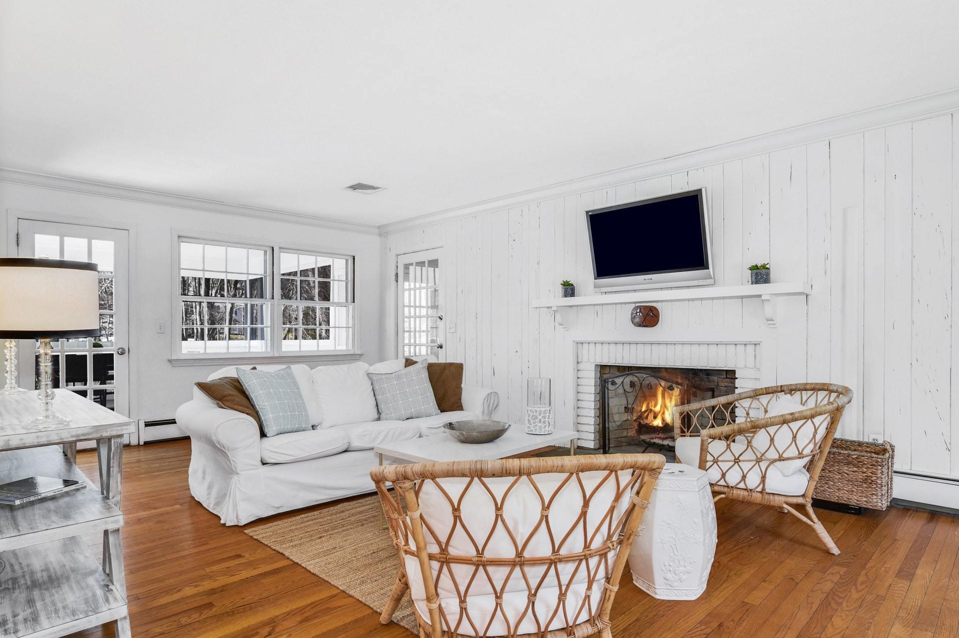 451 Middlesex Road Darien, CT 06820 - Photo 15 of 40 a living room with furniture a fireplace and a flat screen tv