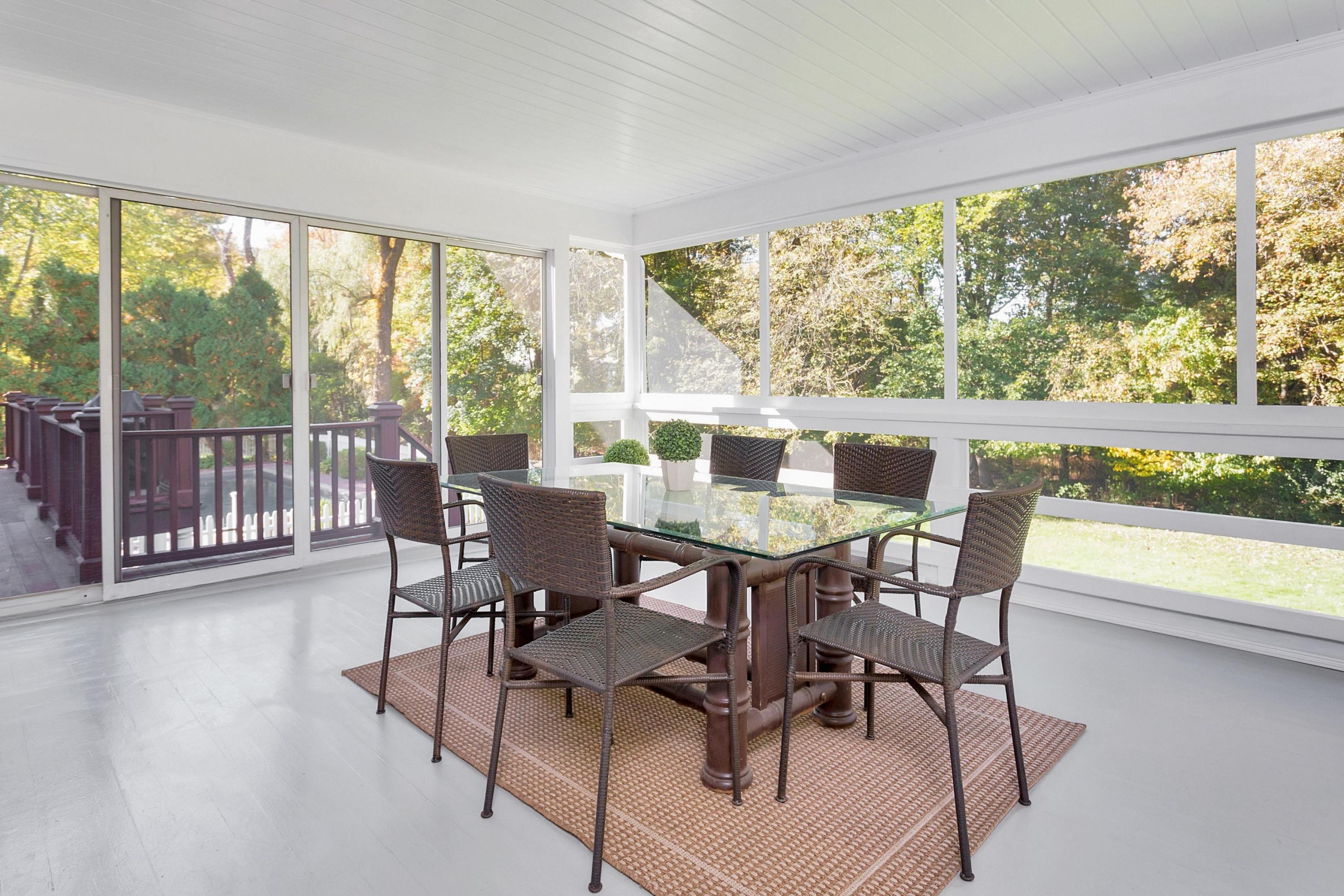 451 Middlesex Road Darien, CT 06820 - Photo 16 of 40 a view of a dining room with furniture window and wooden floor