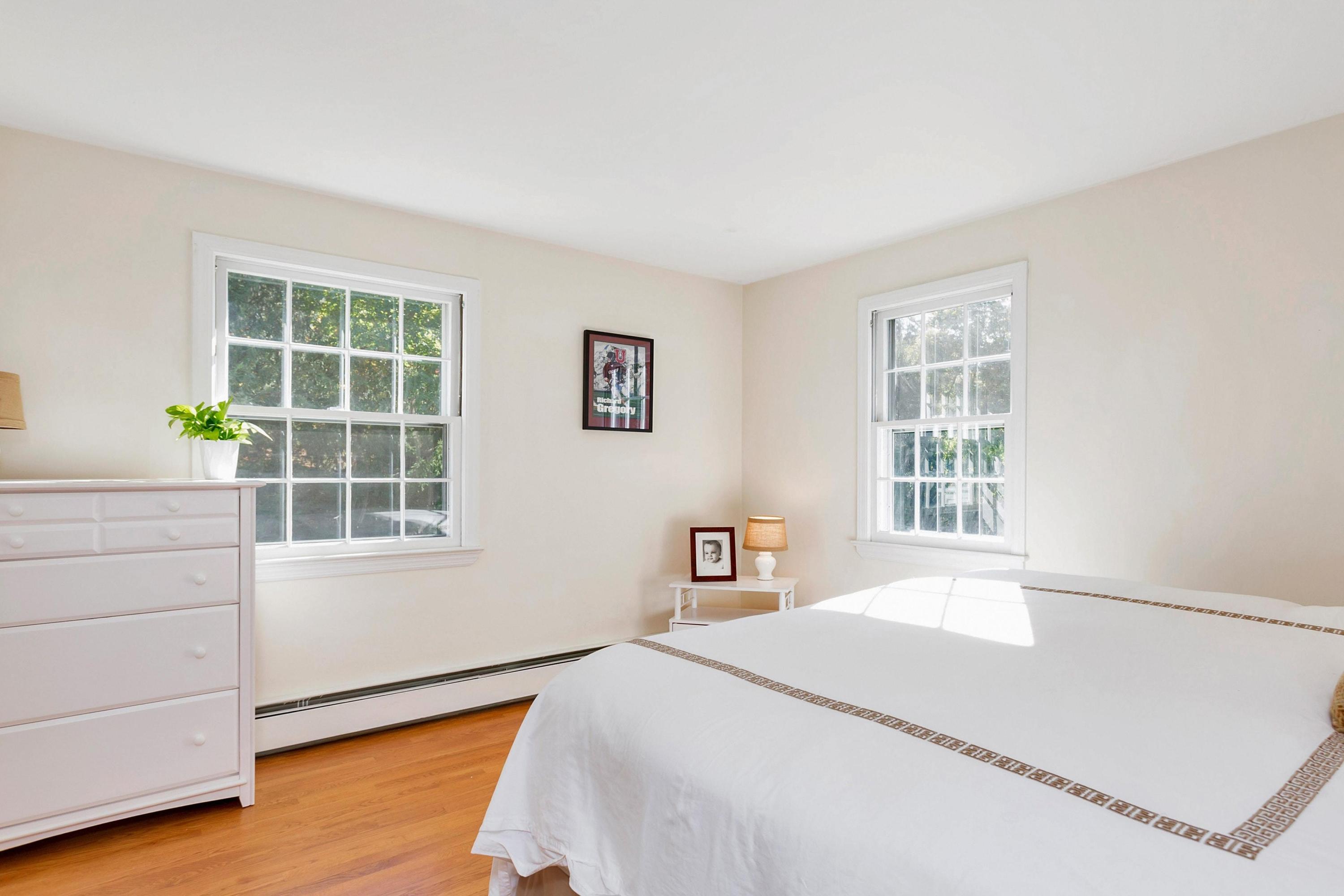 451 Middlesex Road Darien, CT 06820 - Photo 20 of 40 a bedroom with a bed and a window