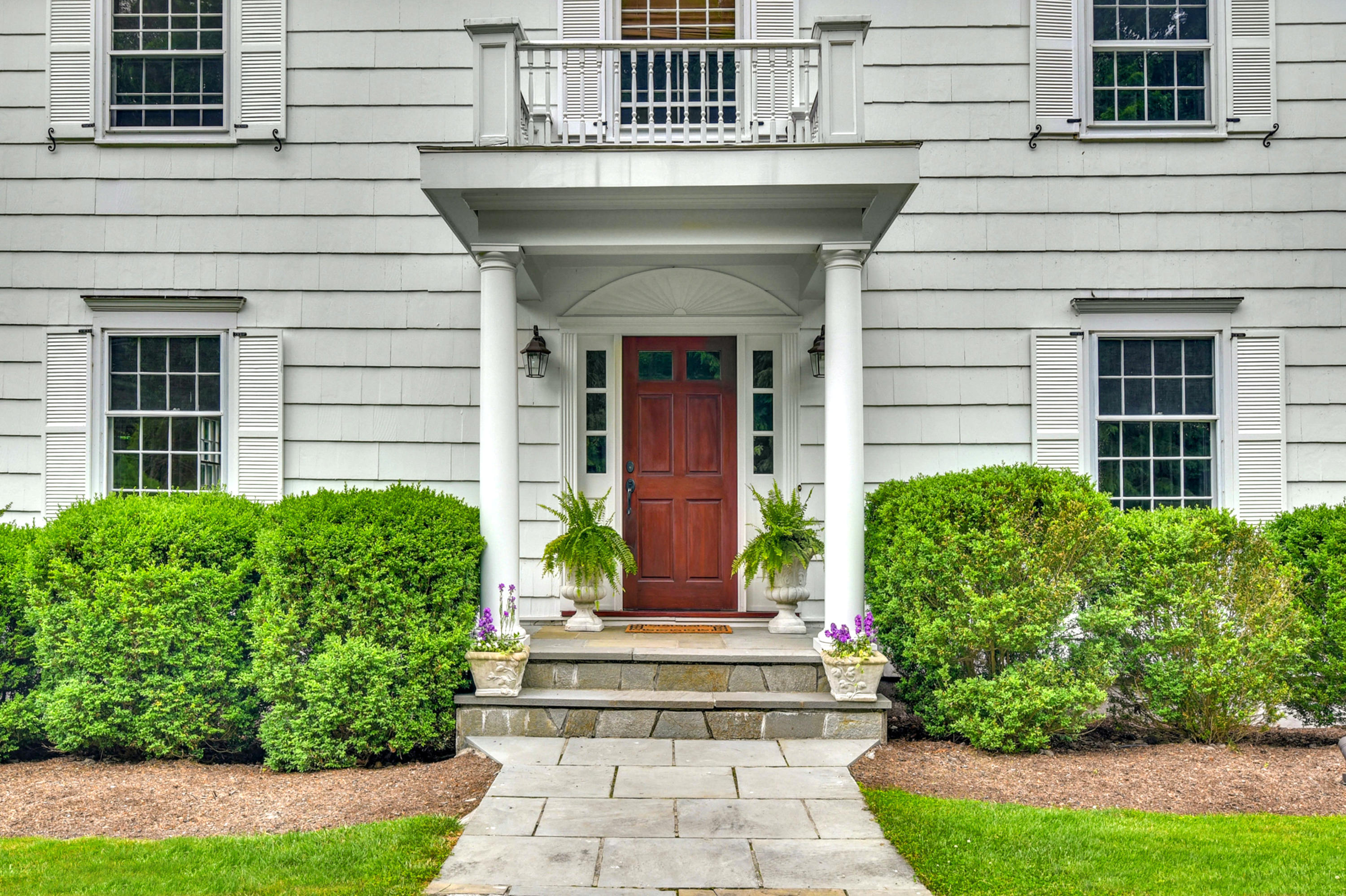 451 Middlesex Road Darien, CT 06820 - Photo 2 of 40 a front view of a house with garden