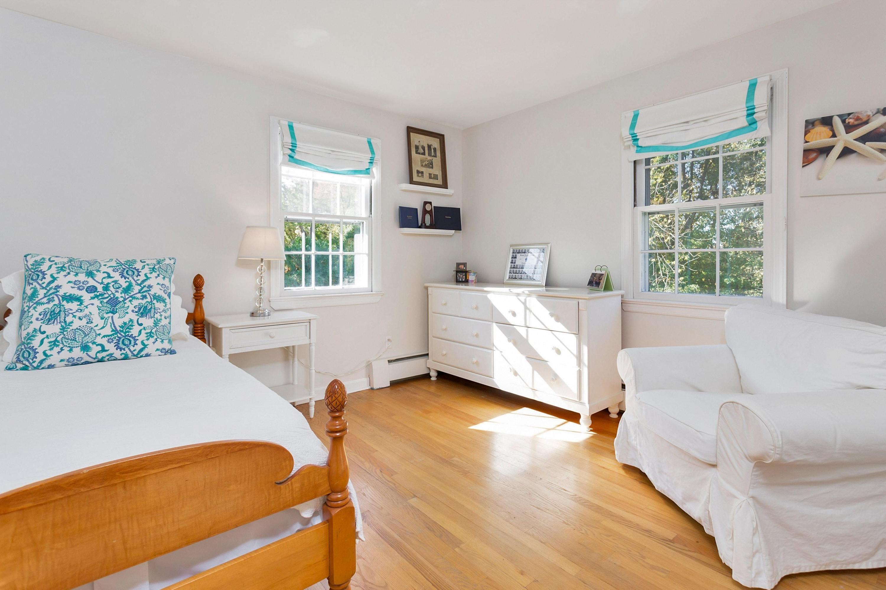 451 Middlesex Road Darien, CT 06820 - Photo 22 of 40 a bedroom with furniture and a window