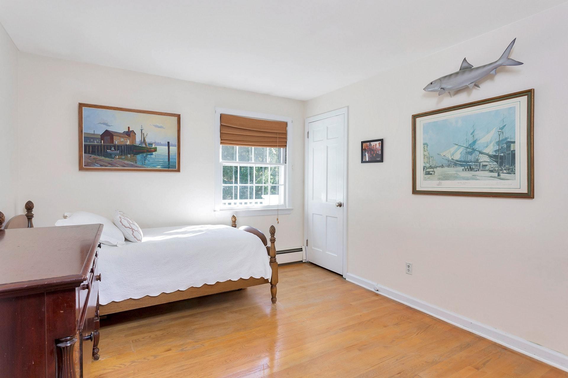 451 Middlesex Road Darien, CT 06820 - Photo 25 of 40 a bedroom with a bed and a window