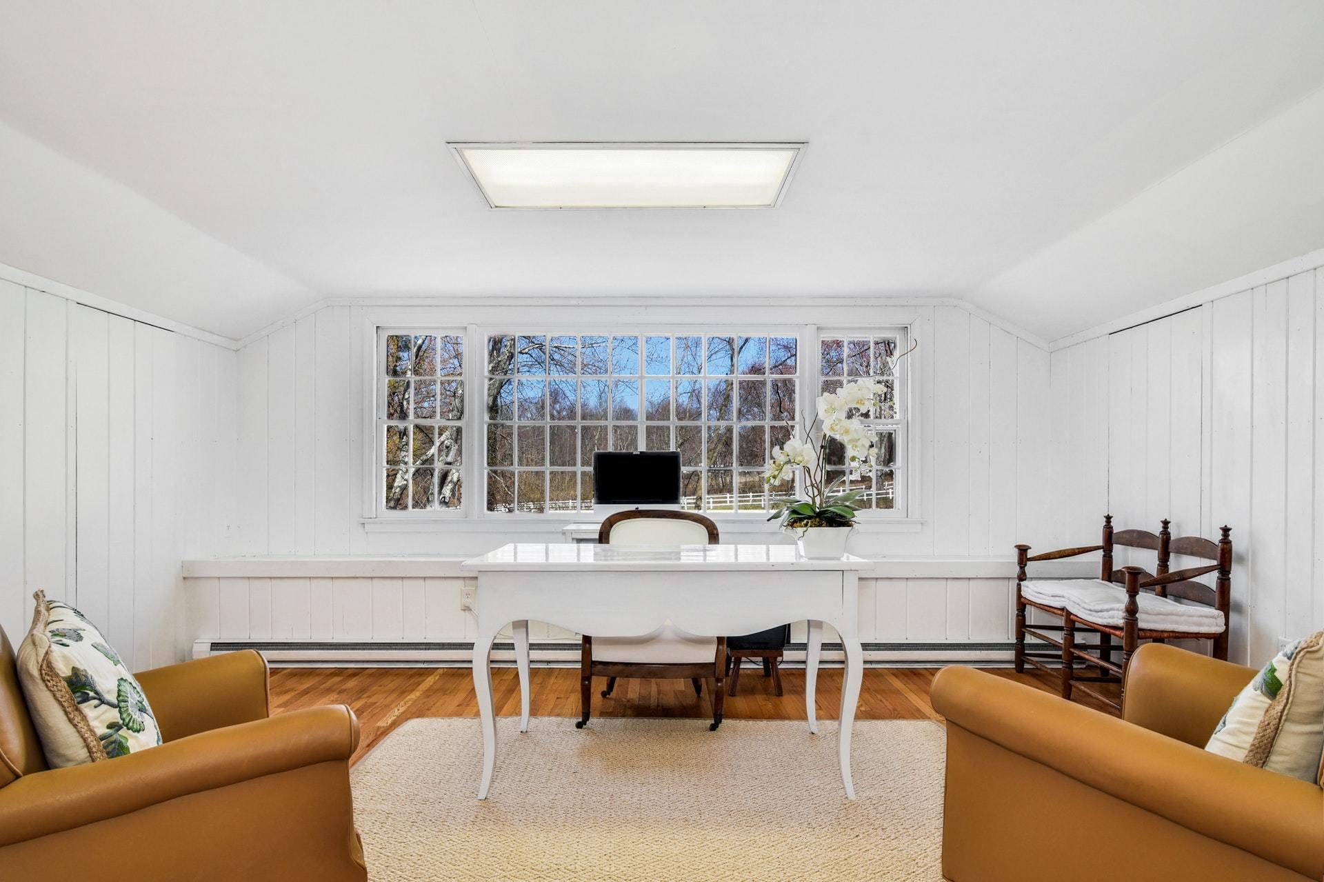 451 Middlesex Road Darien, CT 06820 - Photo 26 of 40 a living room with furniture a ceiling fan and a window