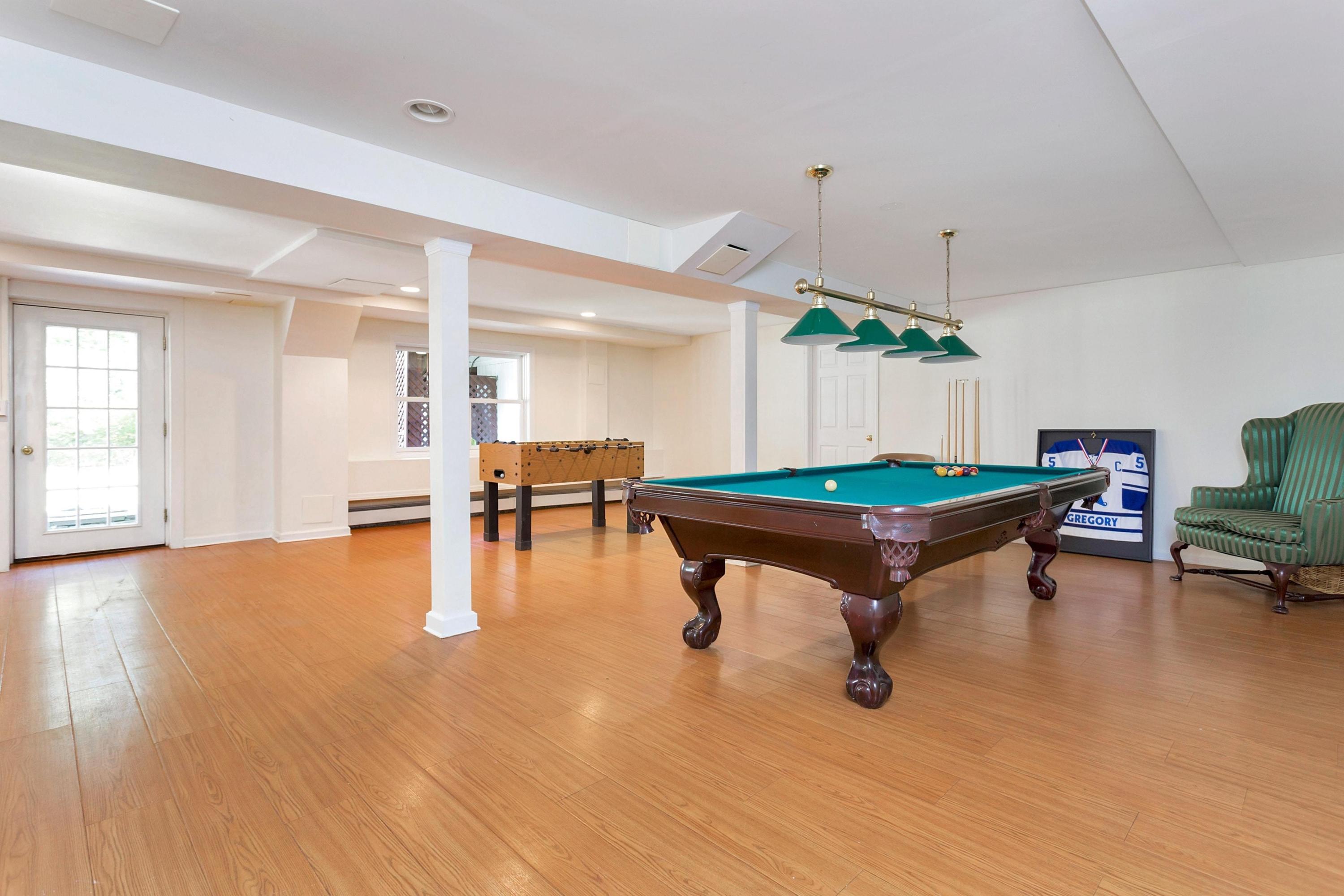 451 Middlesex Road Darien, CT 06820 - Photo 28 of 40 a room with wooden floor and pool table