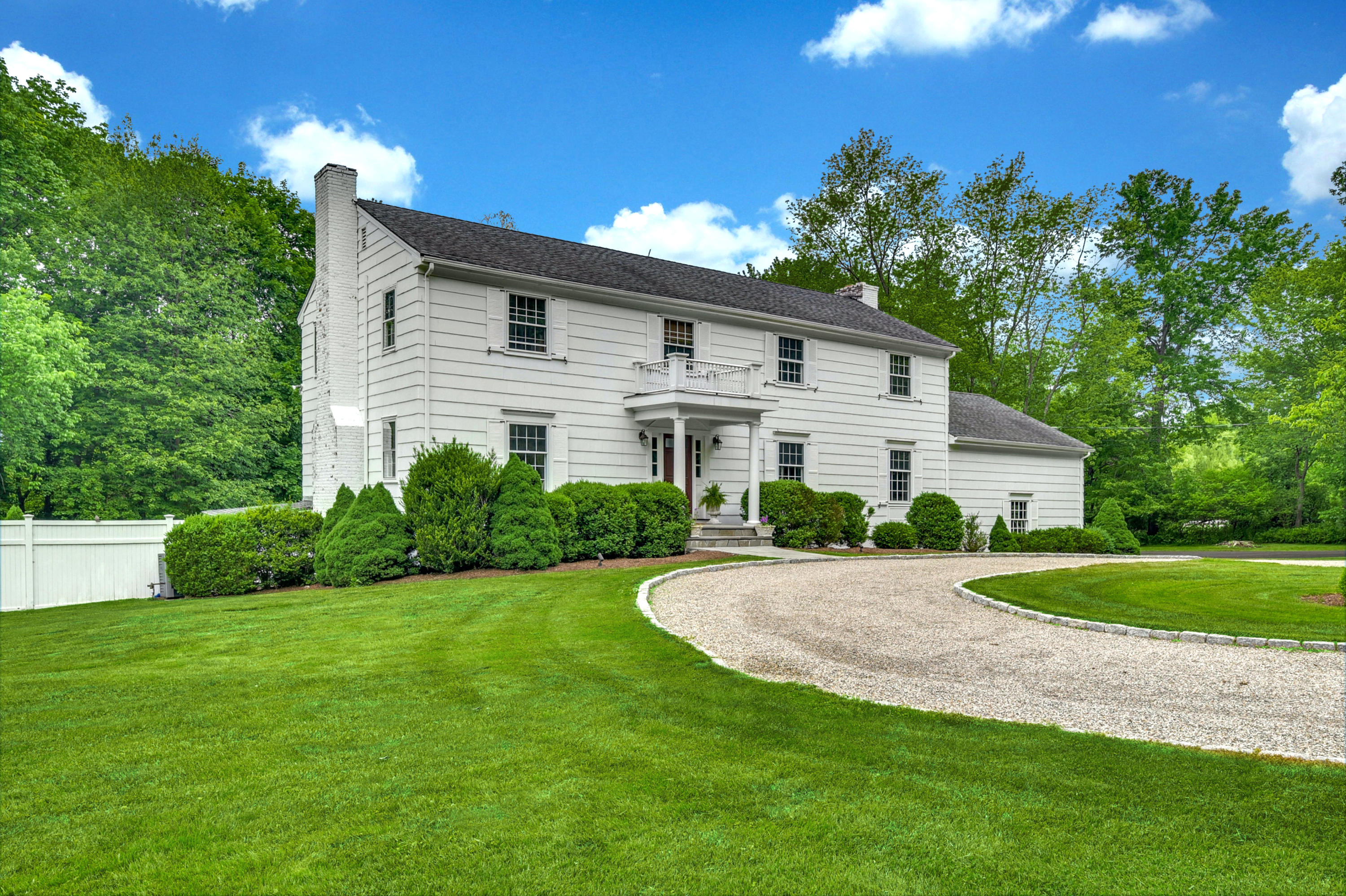 451 Middlesex Road Darien, CT 06820 - Photo 36 of 40 a front view of a house with a yard