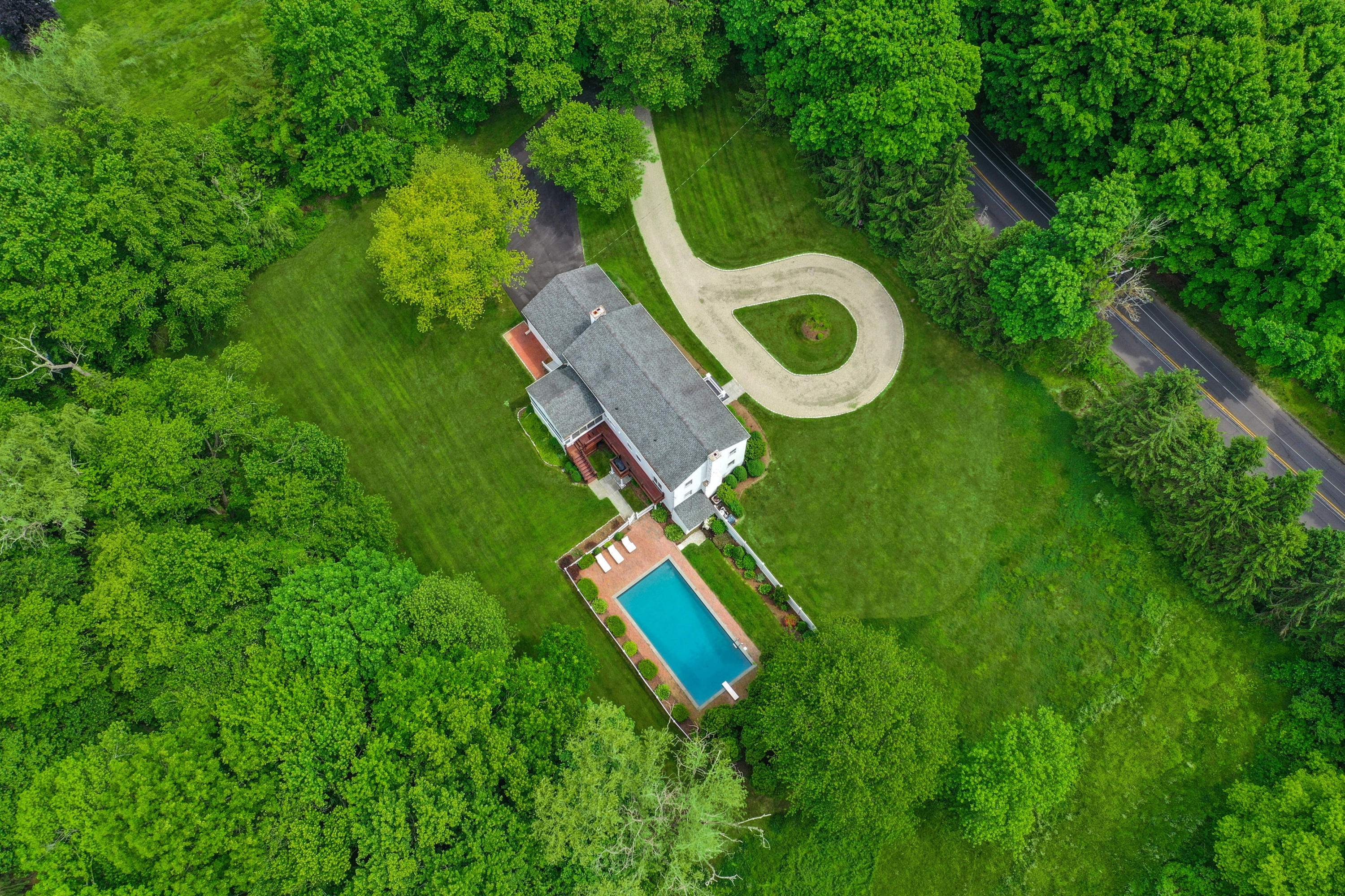 451 Middlesex Road Darien, CT 06820 - Photo 37 of 40 a aerial view of a house with a yard and trees