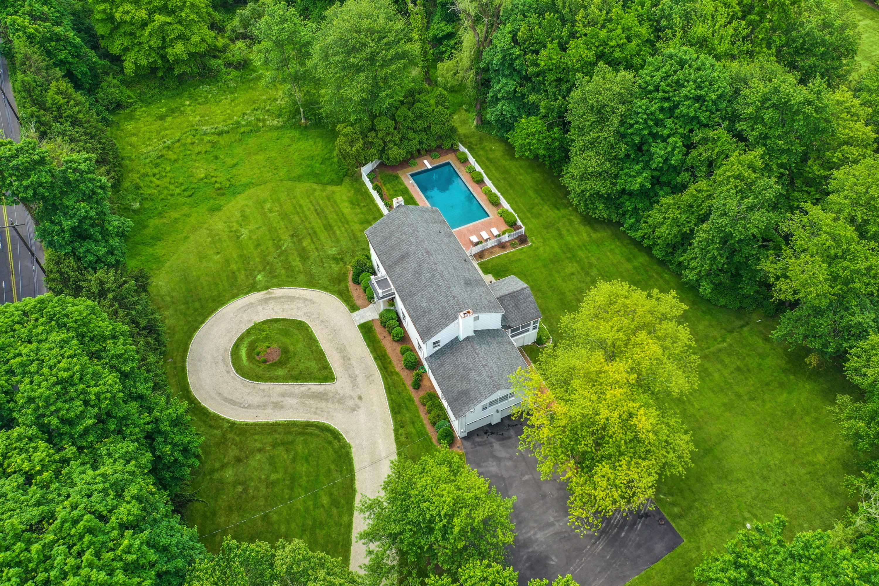 451 Middlesex Road Darien, CT 06820 - Photo 40 of 40 an aerial view of a house with a backyard space and garden