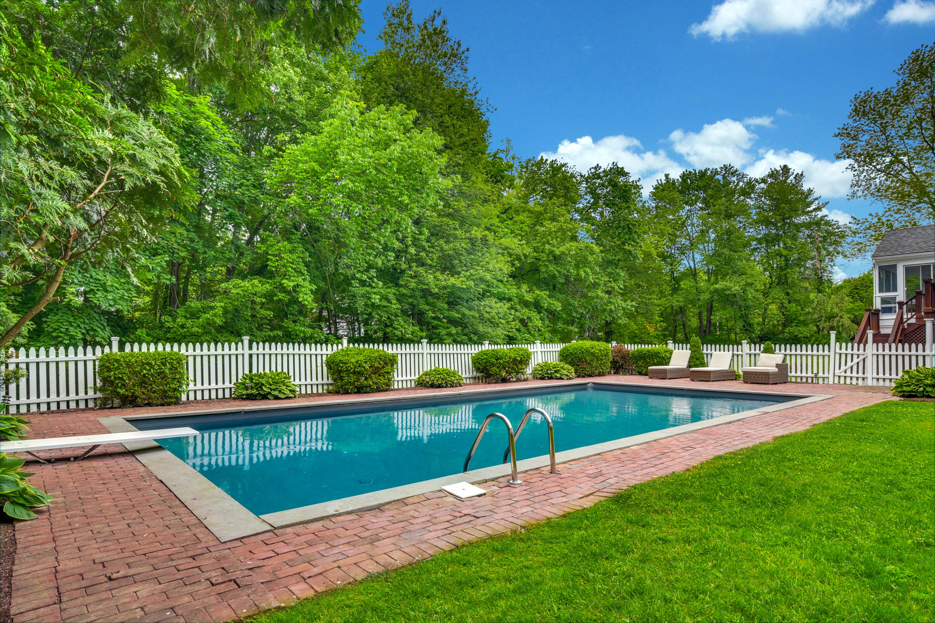 451 Middlesex Road Darien, CT 06820 - Photo 4 of 40 a view of a swimming pool with a yard