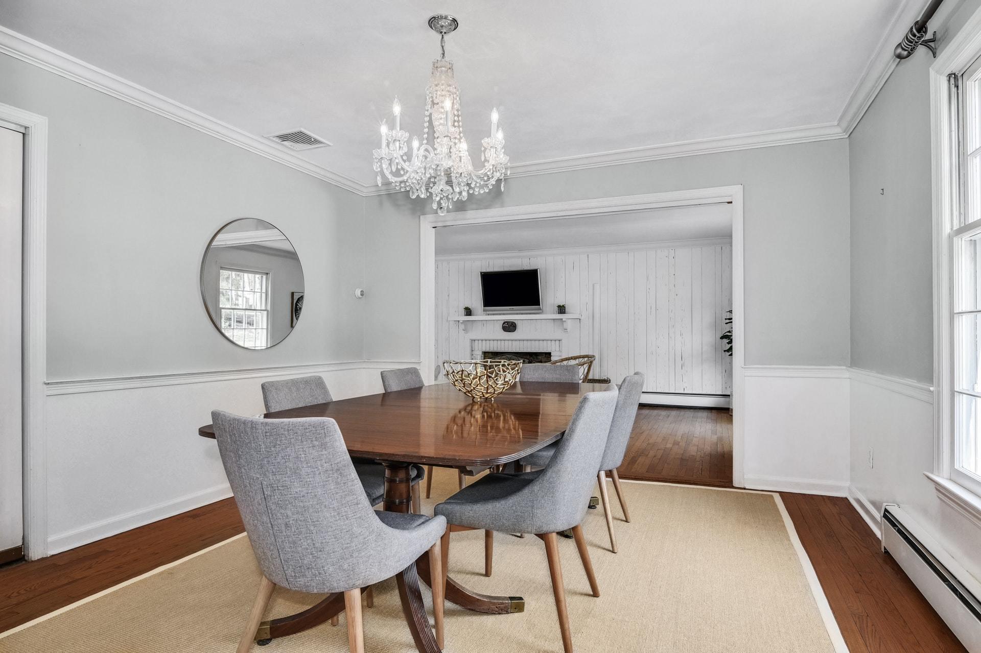 451 Middlesex Road Darien, CT 06820 - Photo 9 of 40 a view of a dining room with furniture a chandelier and wooden floor