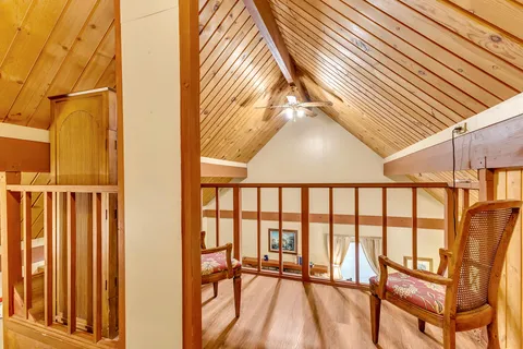 a view of staircase with a rug