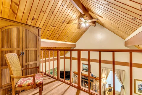 a spacious bedroom with a bed and a table