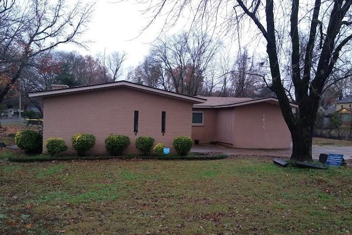 1435 East Holmes Road Memphis, TN 38116 - Photo 1 of 25 a backyard of a house with lots of green space