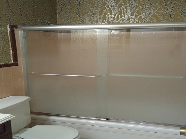 1435 East Holmes Road Memphis, TN 38116 - Photo 13 of 25 a bathroom with a shower and a toilet