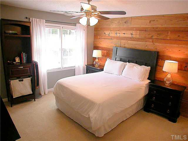 23 Thorne Ridge Drive Durham, NC 27713 - Photo 4 of 25 200 year old North Carolina kiln dried wood creates a beautiful backdrop to this master bedroom. Master Bedroom