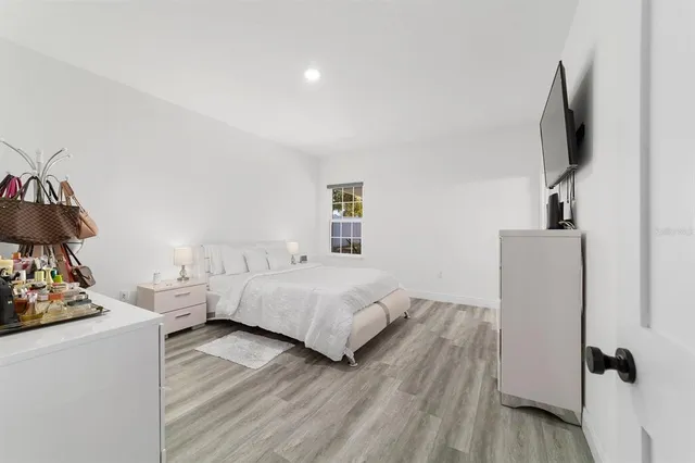 a room with a bed and a view of bedroom