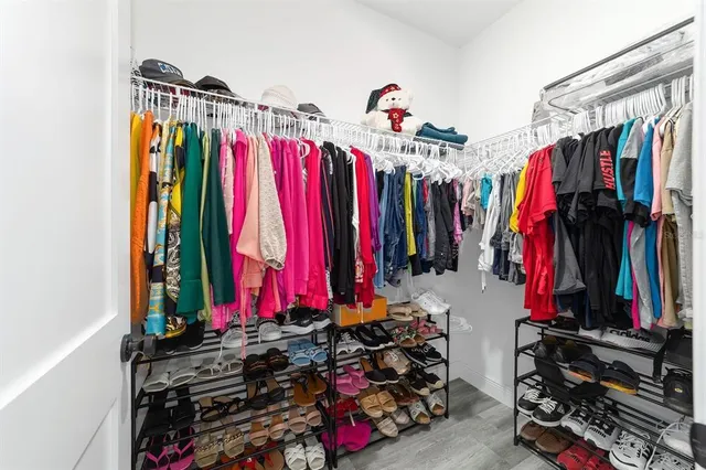 a bedroom with two beds and a window