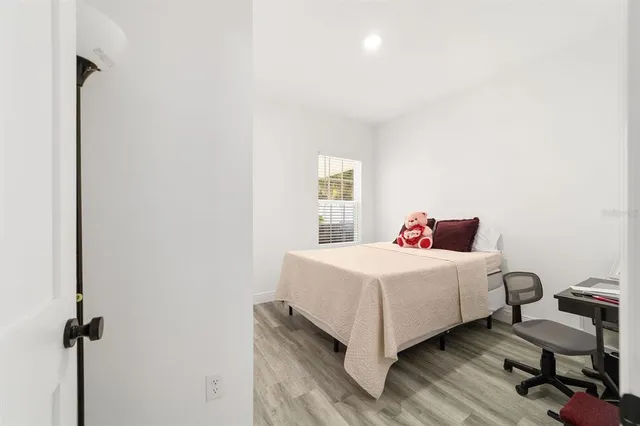 a room with a bed and a window