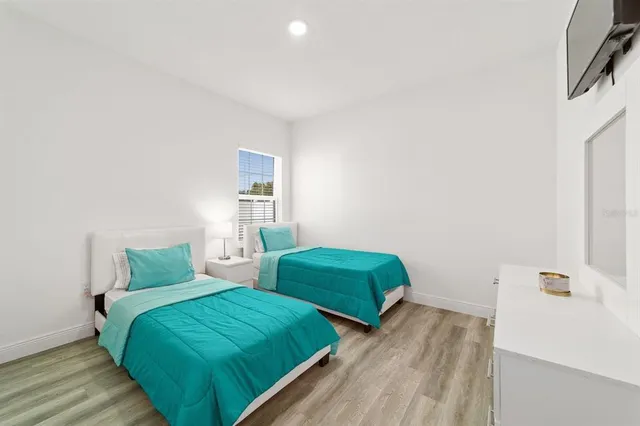 a view of a dining room with furniture and a potted plant