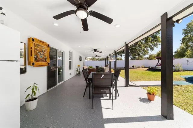 a view of a swimming pool with a yard