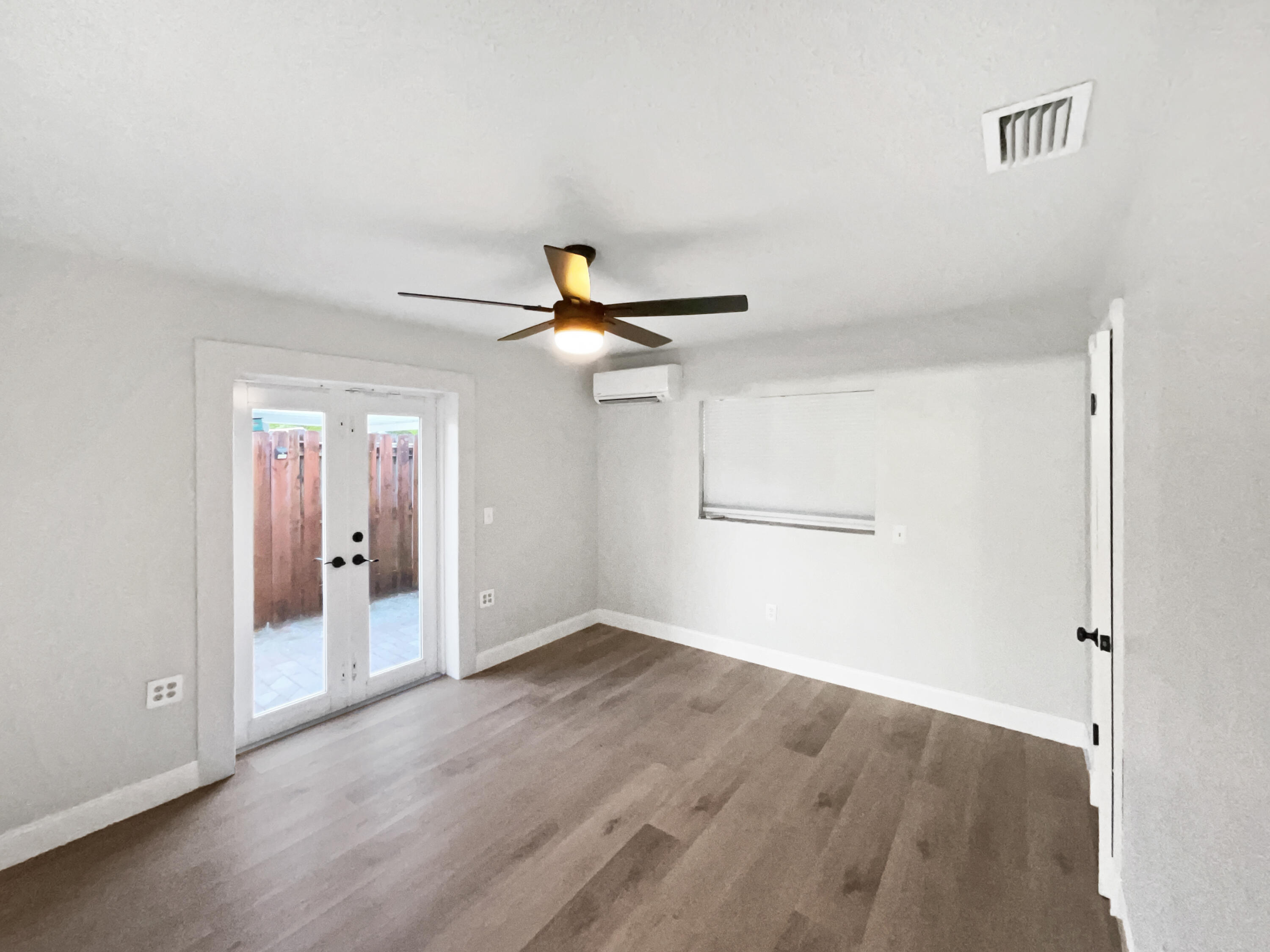 22226 Southwest 65th Terrace Boca Raton, FL 33428 - Photo 15 of 27 wooden floor in an empty room