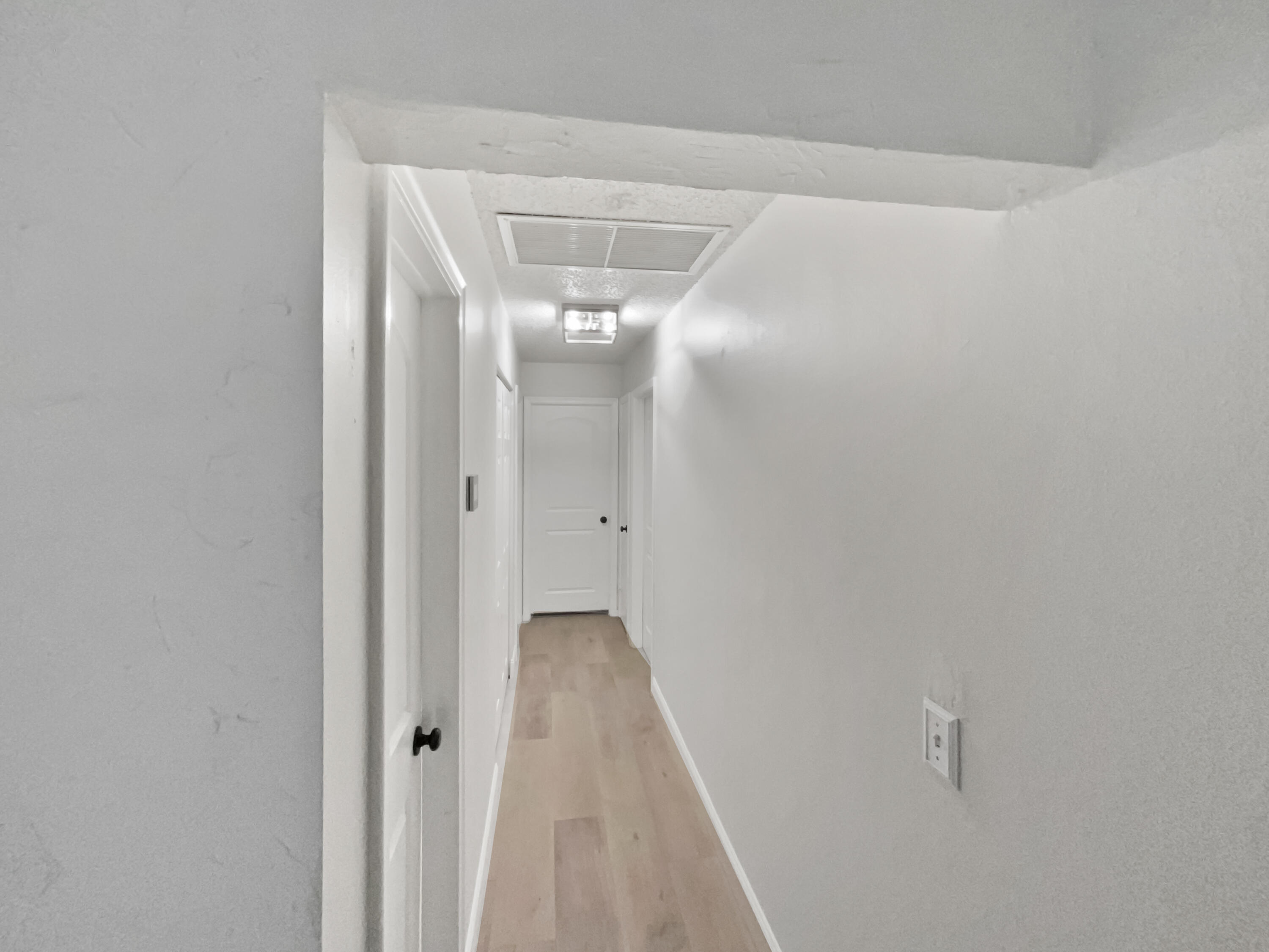 22226 Southwest 65th Terrace Boca Raton, FL 33428 - Photo 19 of 27 a view of a hallway with wooden floor