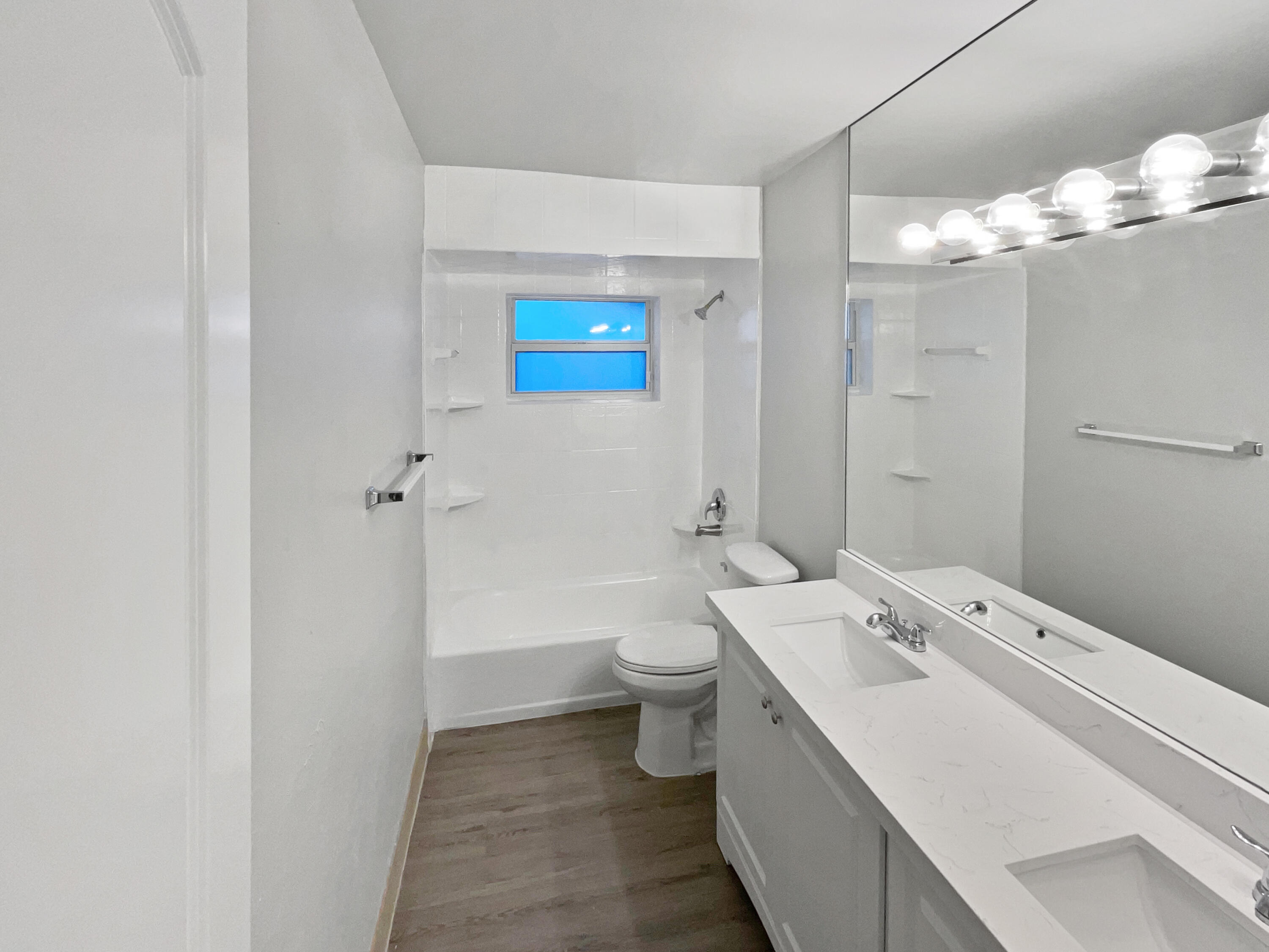 22226 Southwest 65th Terrace Boca Raton, FL 33428 - Photo 25 of 27 a bathroom with a double vanity sink toilet and shower