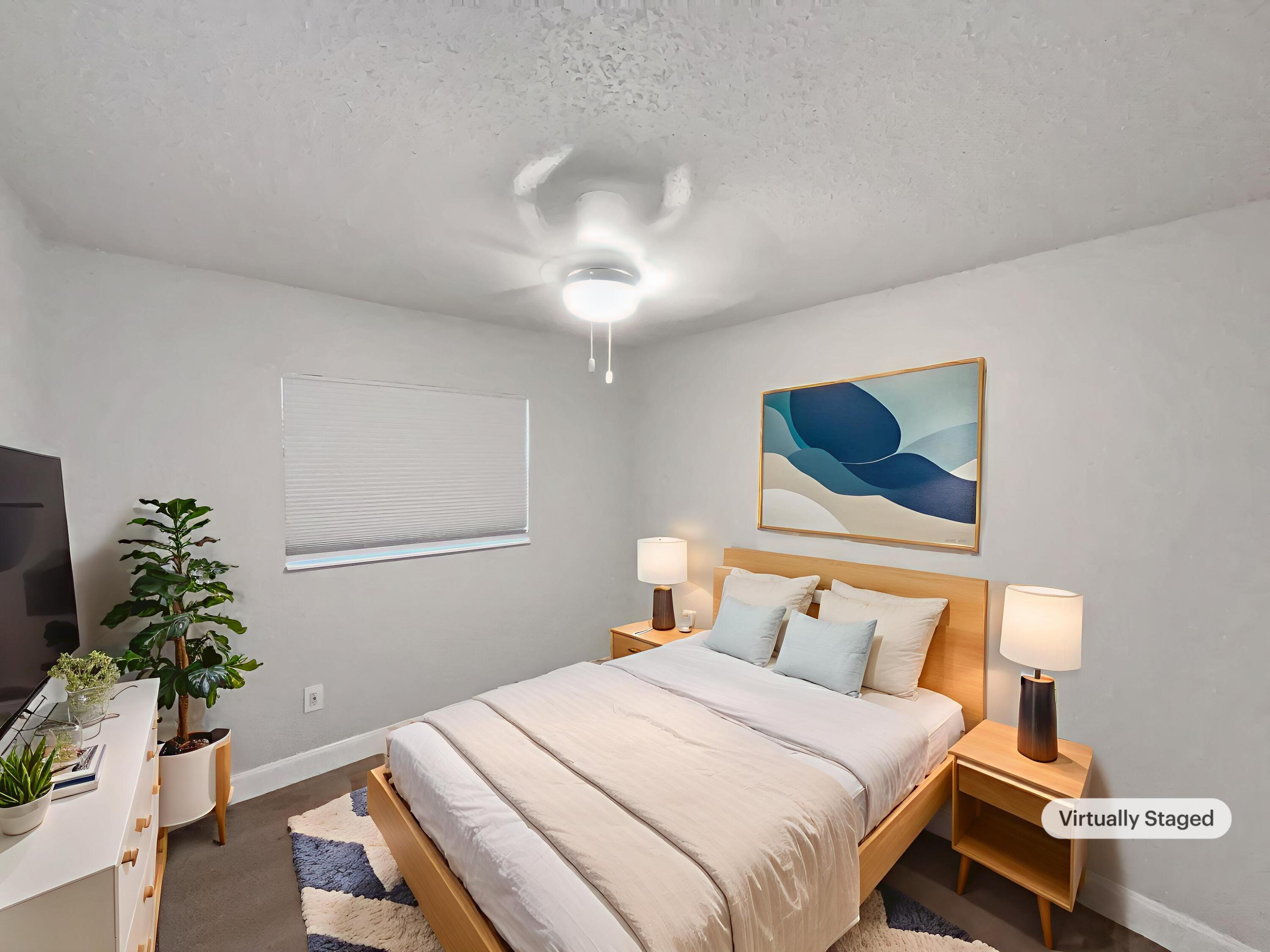 22226 Southwest 65th Terrace Boca Raton, FL 33428 - Photo 4 of 27 a bedroom with bed and window