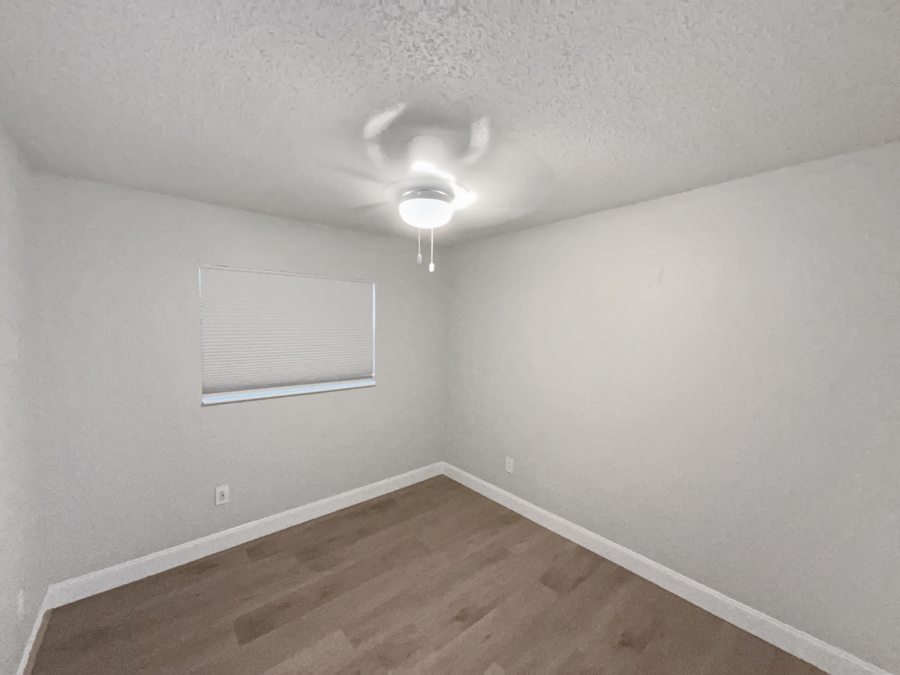 22226 Southwest 65th Terrace Boca Raton, FL 33428 - Photo 5 of 27 wooden floor in an empty room