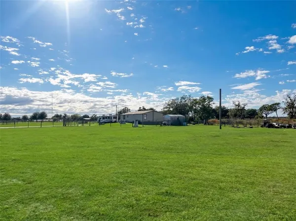 a view of field with ocean