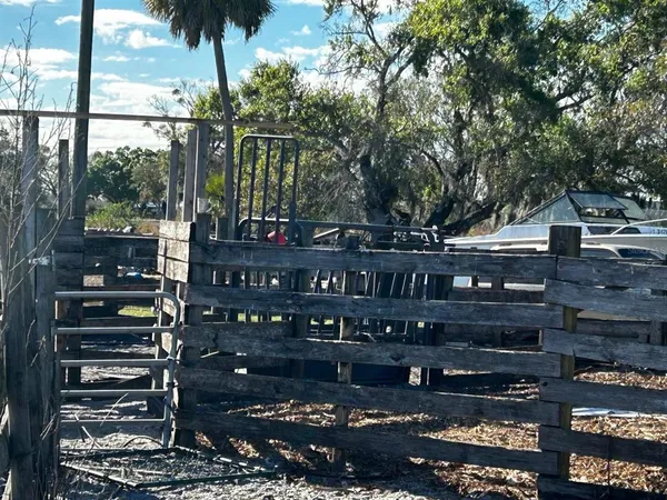a view of street with wooden fence