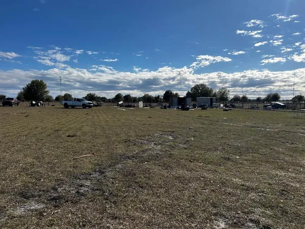 a view of a yard with table and chairs