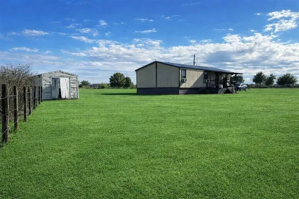 a view of a back yard of the house