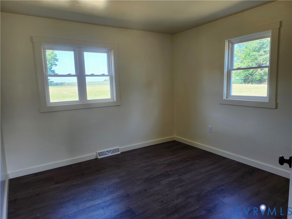 303 Putney Road Cumberland, VA 23040 - Photo 6 of 6 New flooring , light-toned walls, and multiple win