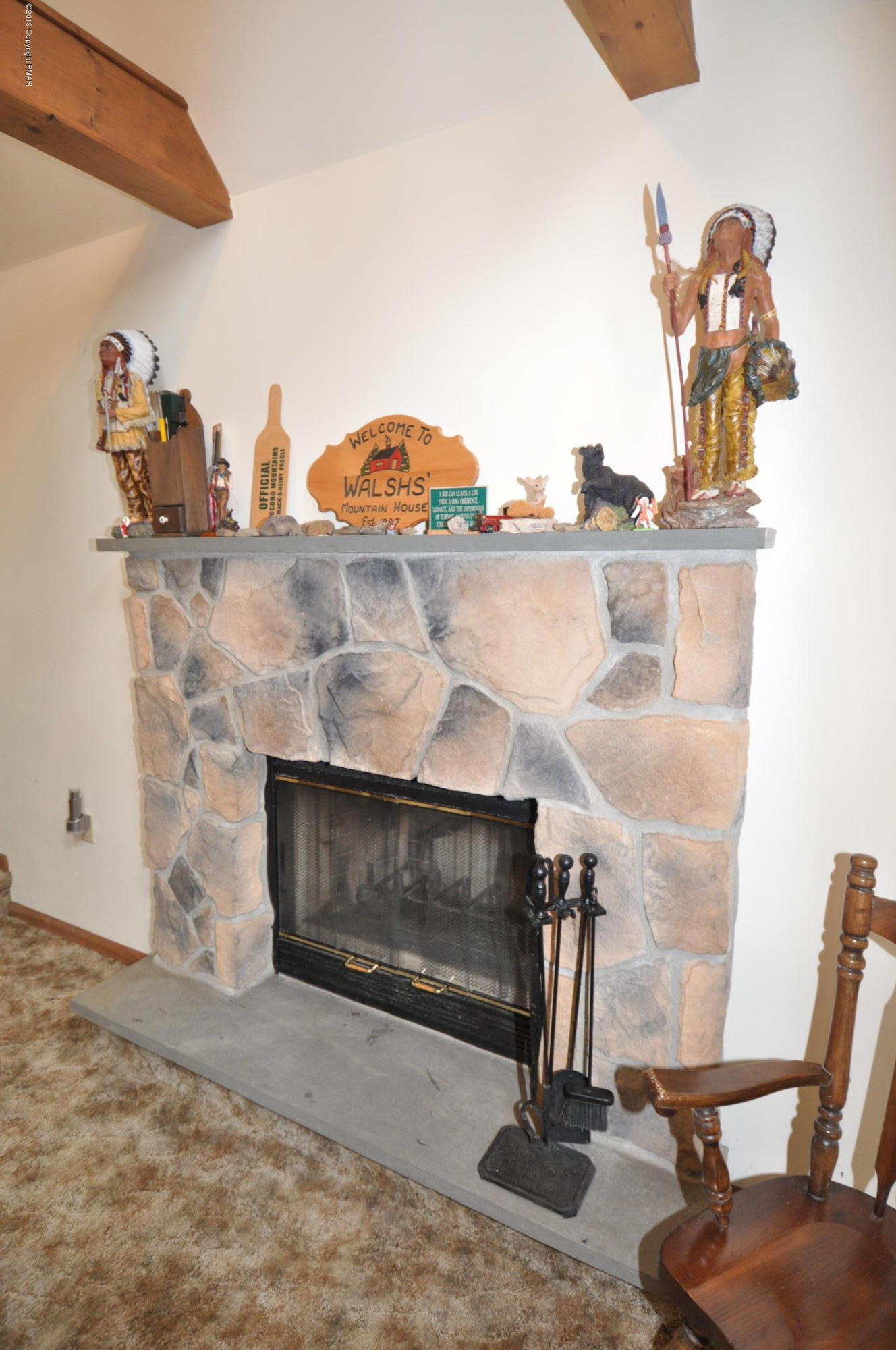 1150 Boulder Road Blakeslee, PA 18610 - Photo 23 of 37 a living room with furniture and a fireplace