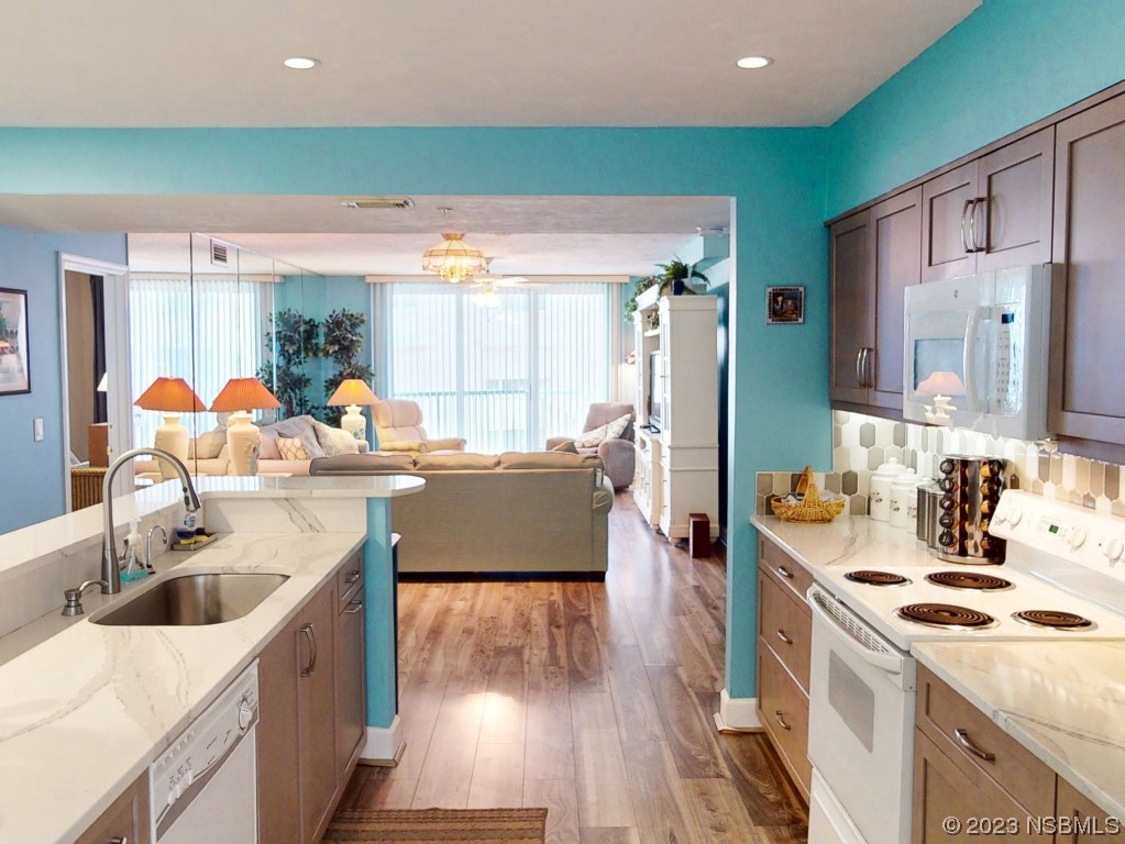 4555 South Atlantic Avenue, Unit 4502 Ponce Inlet, FL 32127 - Photo 12 of 54 a kitchen with a sink stove and cabinets