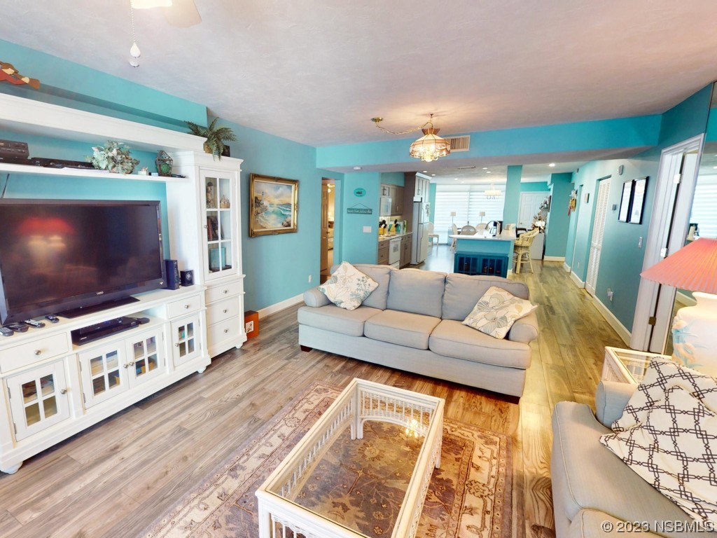 4555 South Atlantic Avenue, Unit 4502 Ponce Inlet, FL 32127 - Photo 18 of 54 a living room with furniture and a flat screen tv