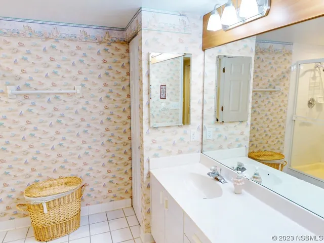 a bathroom with a sink and a shower