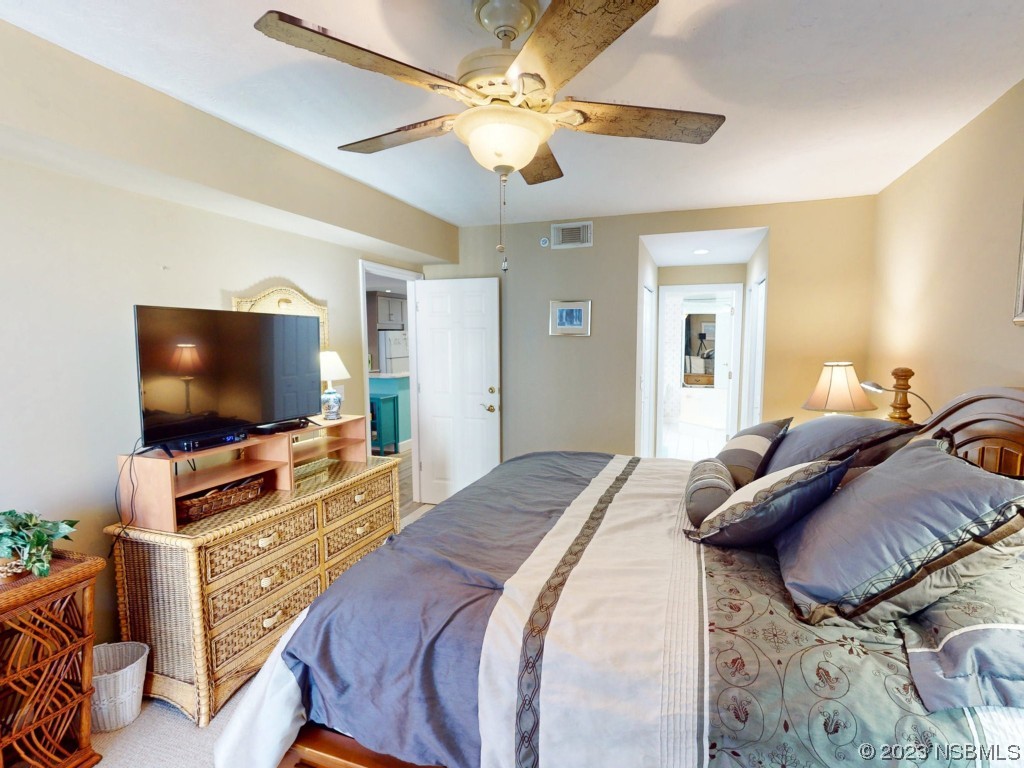 4555 South Atlantic Avenue, Unit 4502 Ponce Inlet, FL 32127 - Photo 26 of 54 a bedroom with a bed and a flat screen tv