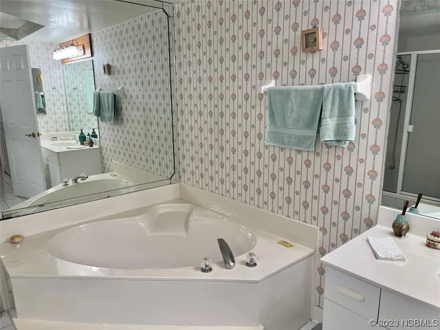 a bathroom with a bathtub and a sink