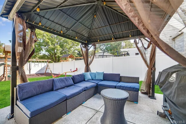 a patio with a table and chairs