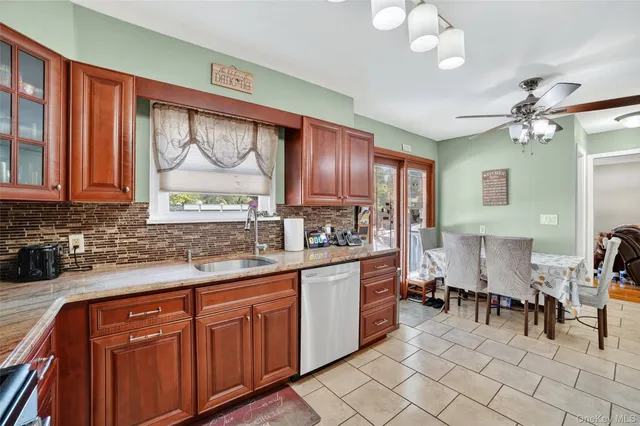 a kitchen with stainless steel appliances a sink and cabinets