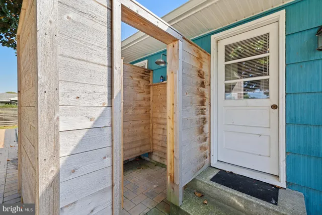 a view of a backyard with a tree
