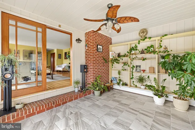 a view of a porch with a potted plant