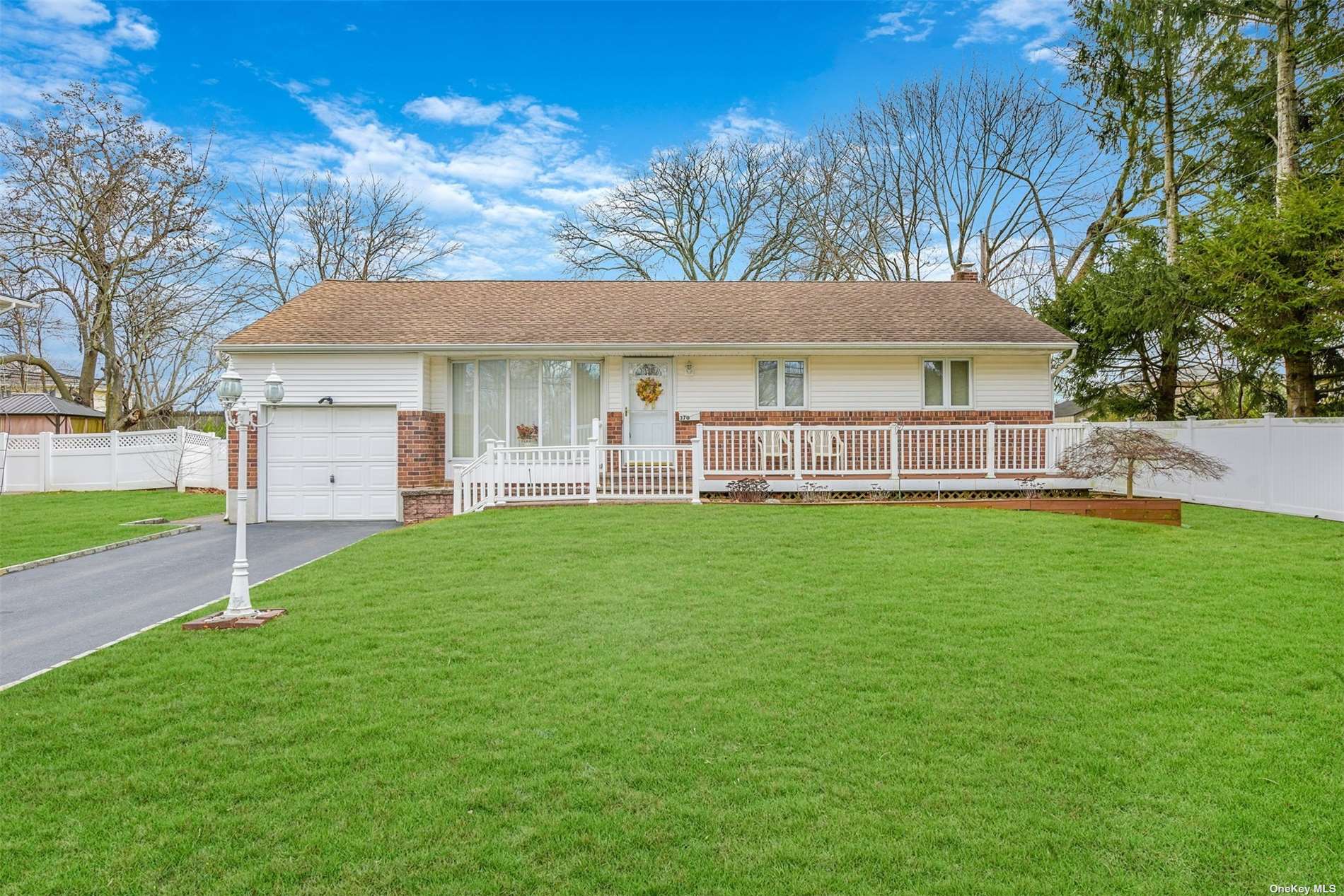 a view of a house with a yard porch and sitting area