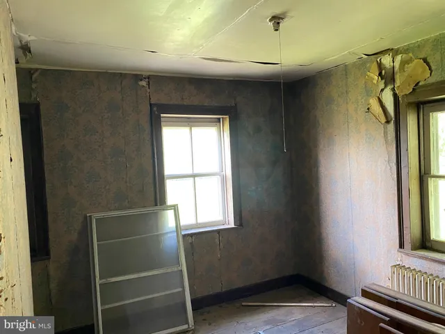 a view of a swimming pool with a yard and mountain view