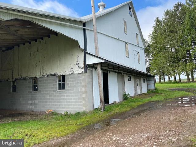 a view of walk in closet with wooden floor